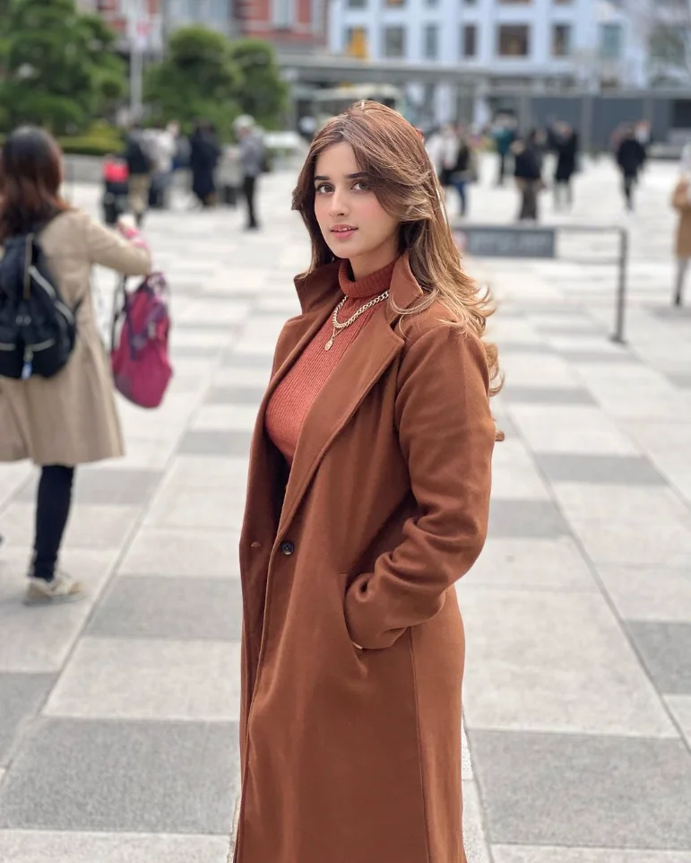 Alishbah Annjum wearing a long coat